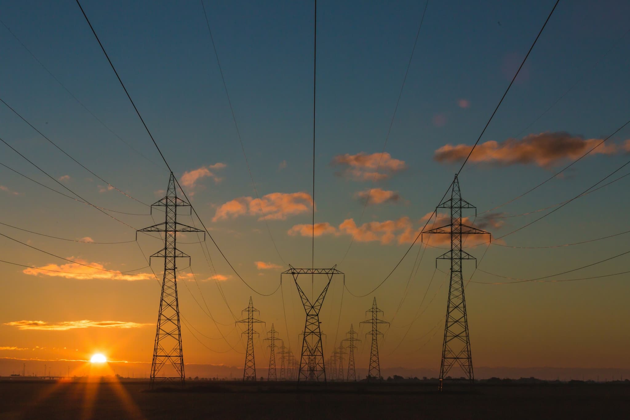 High-voltage transmission lines at dusk